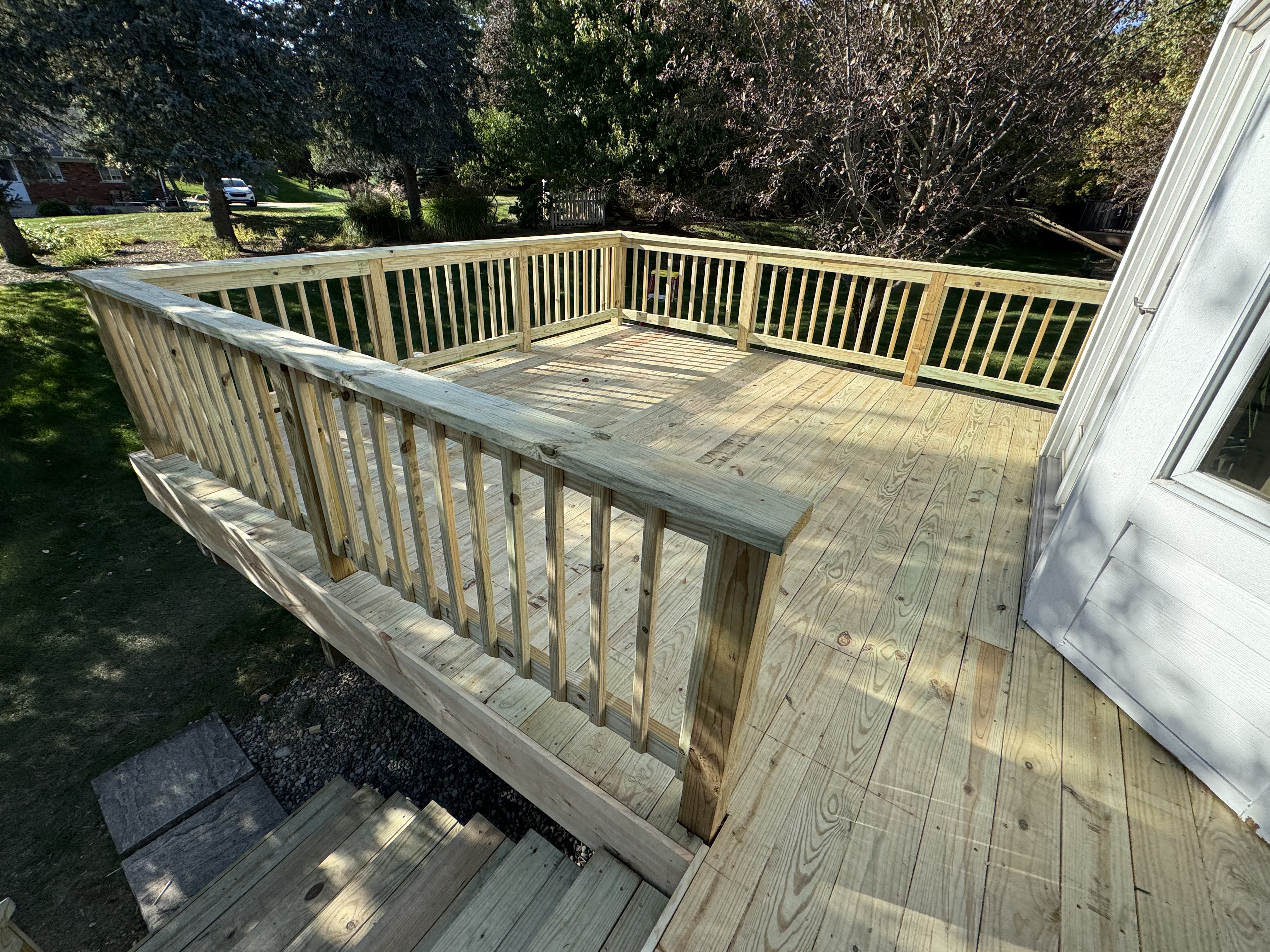 Elevated pine deck with wood railings