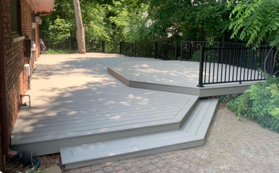 Gray Trex deck with custom steps by Tans Construction